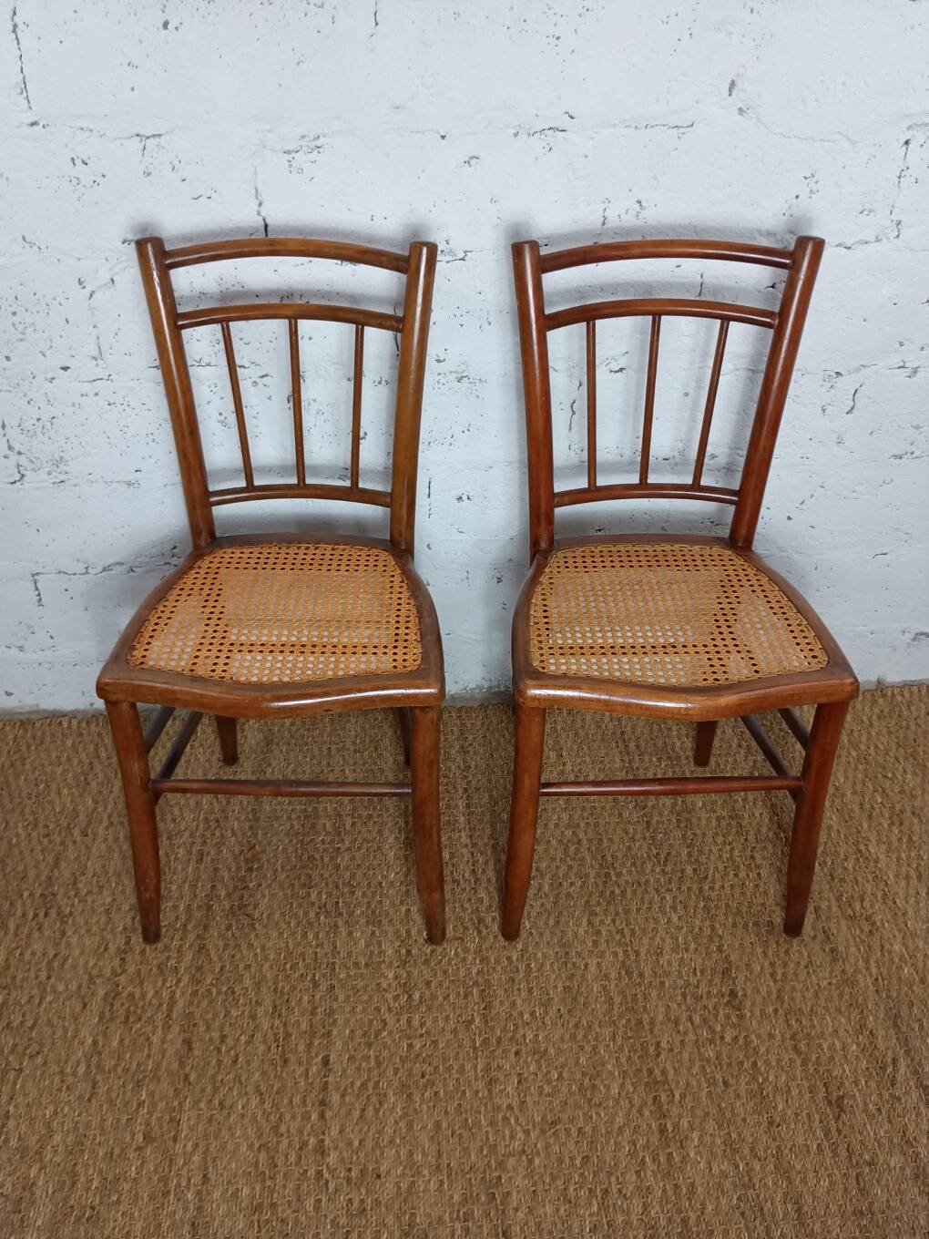 pair of caned bistro chairs from the 1930s