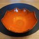 Orange ceramic star-shaped empty bowl