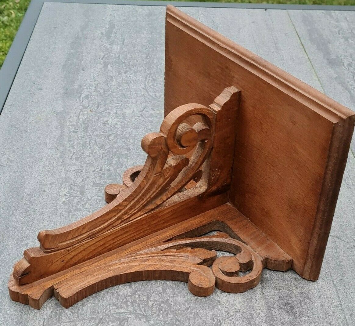 Openwork wooden wall shelf