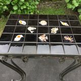 Vintage ceramic coffee table by Guy Trévoux with wrought iron base.