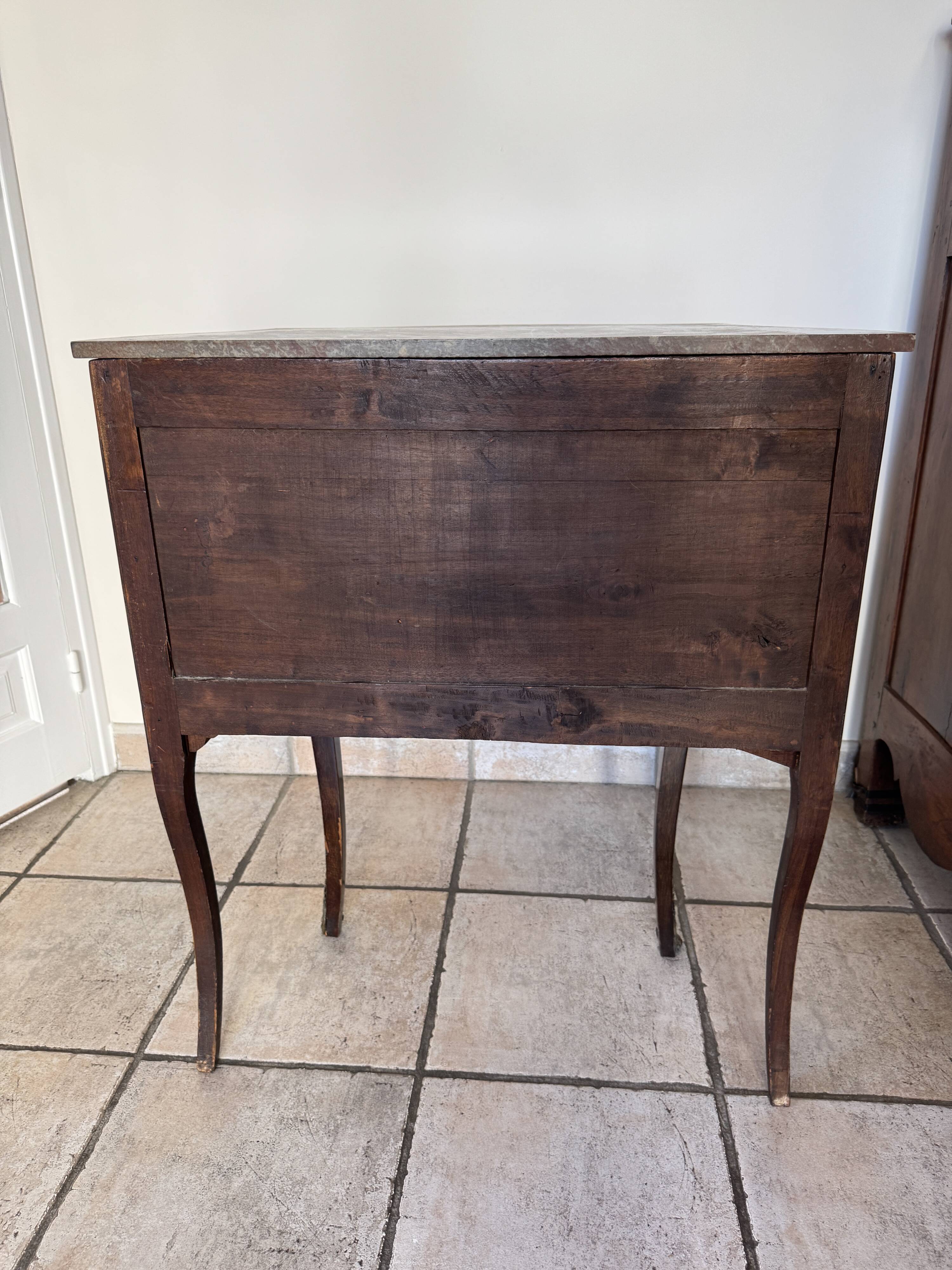 Small curved chest of drawers in Louis XV style