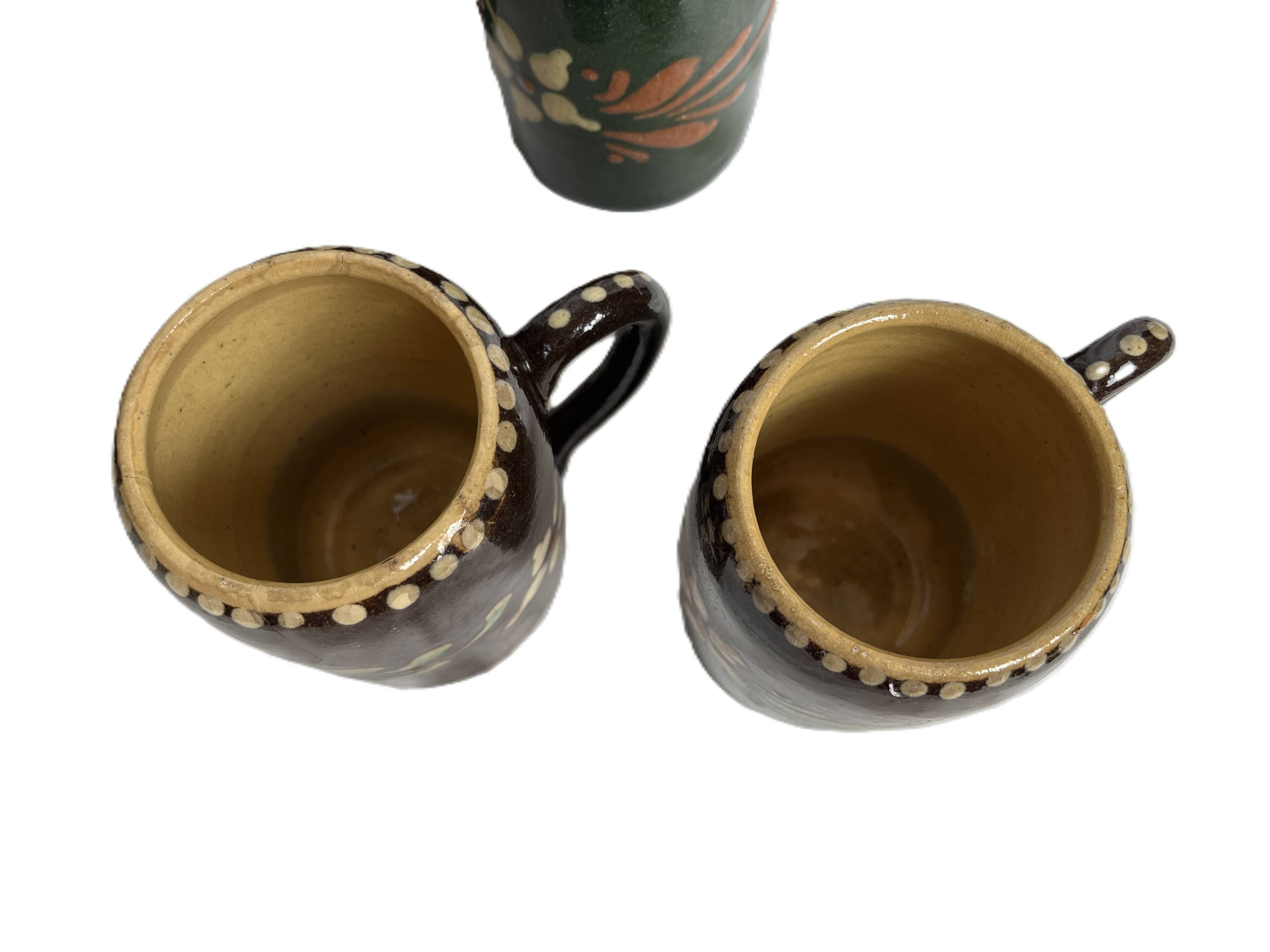 Alsatian pottery, glazed stoneware mug from Soufflenheim, 20th century.