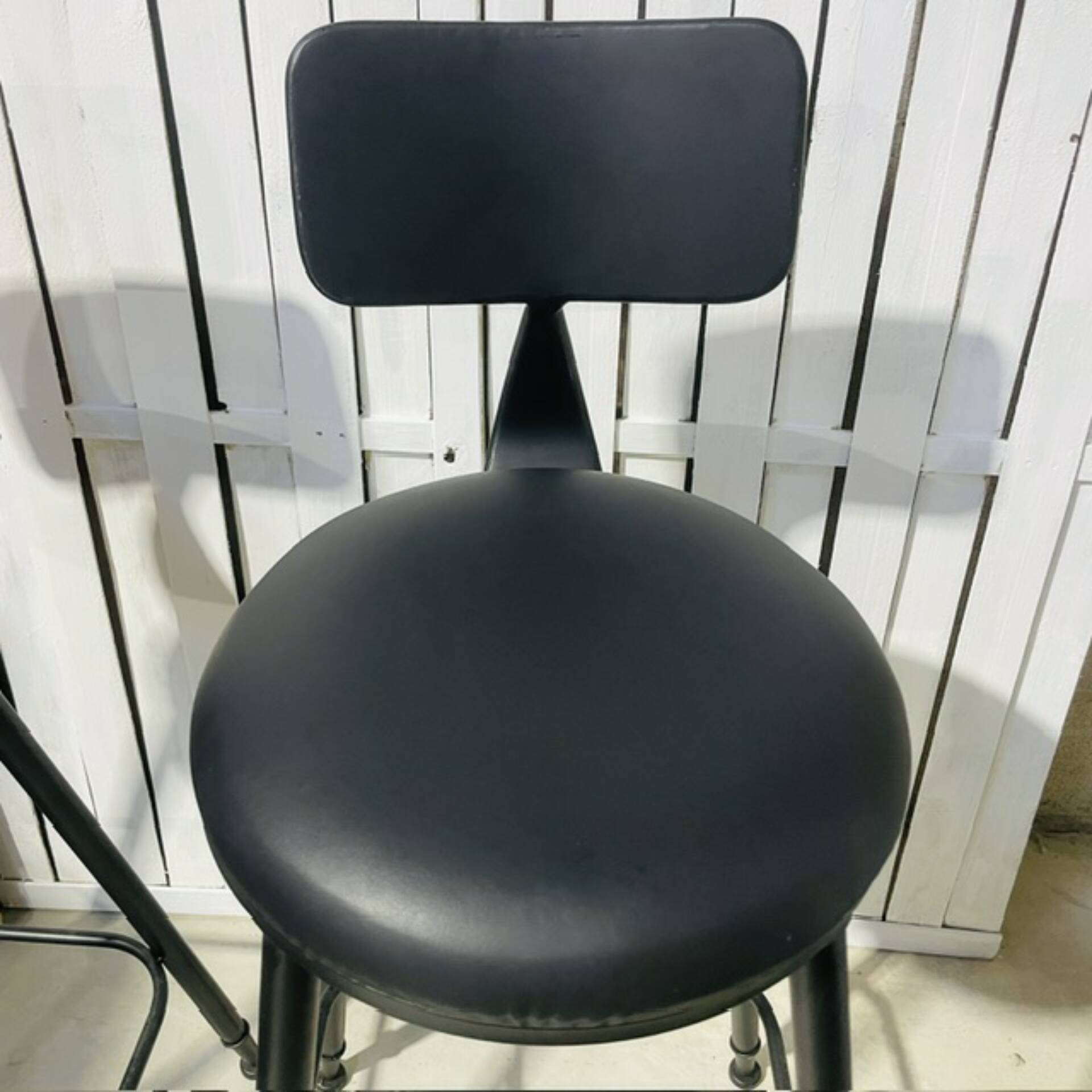 Pair of black bar stools in industrial and contemporary style.