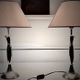 Contemporary table lamp in polished chrome with a conical fabric shade.