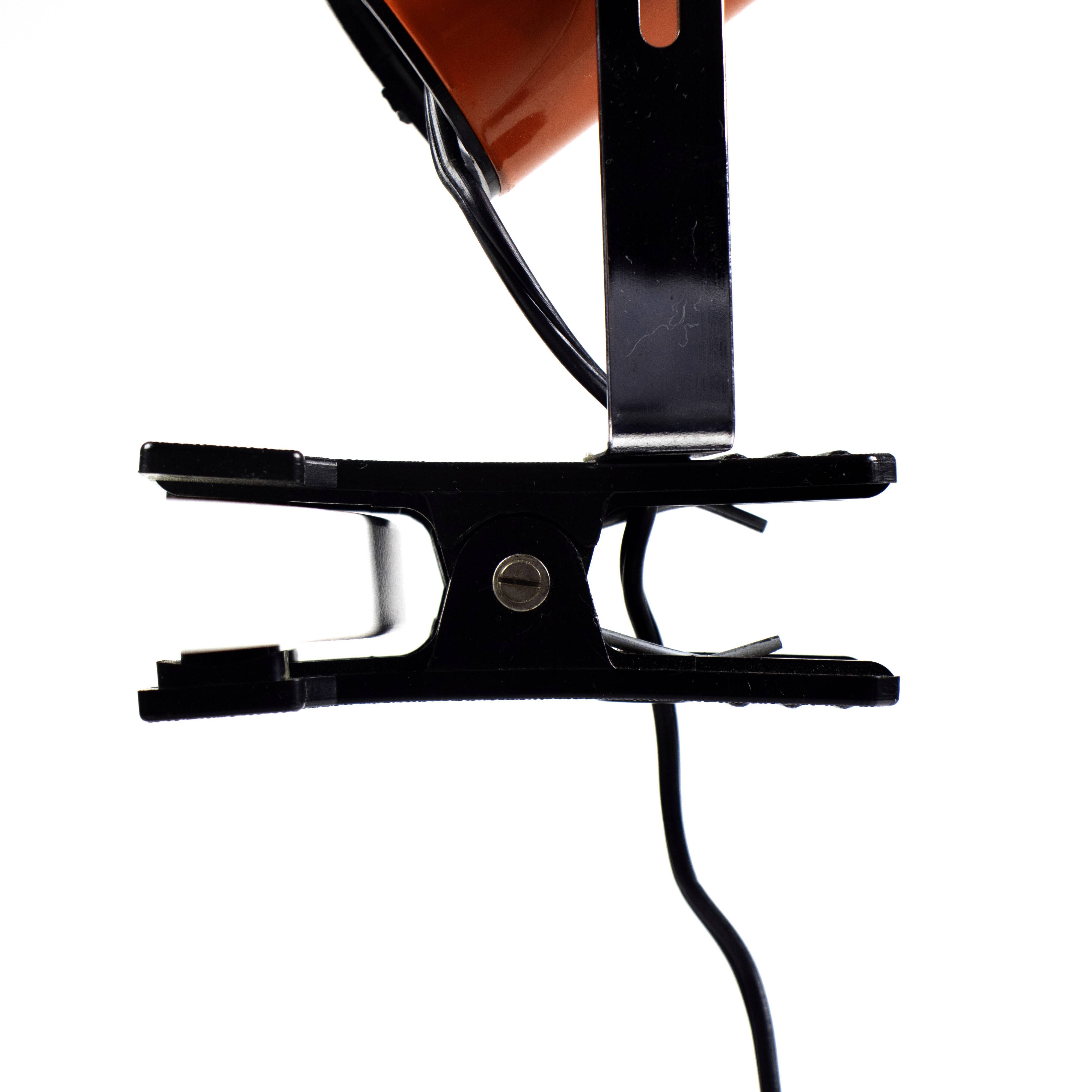 Vintage orange clamp spotlight from the 70s