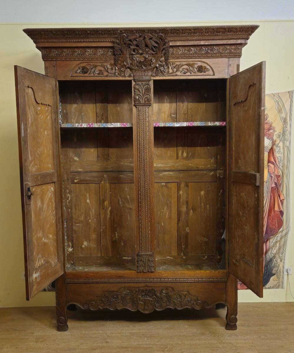 Norman Wedding Armoire in solid oak, richly carved, Louis period.