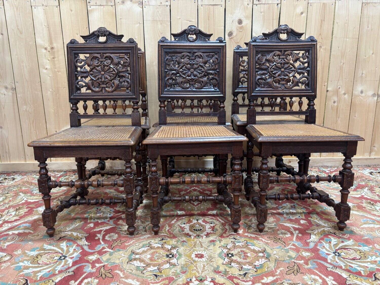 6 High Era chairs in carved solid oak and rattan caning.