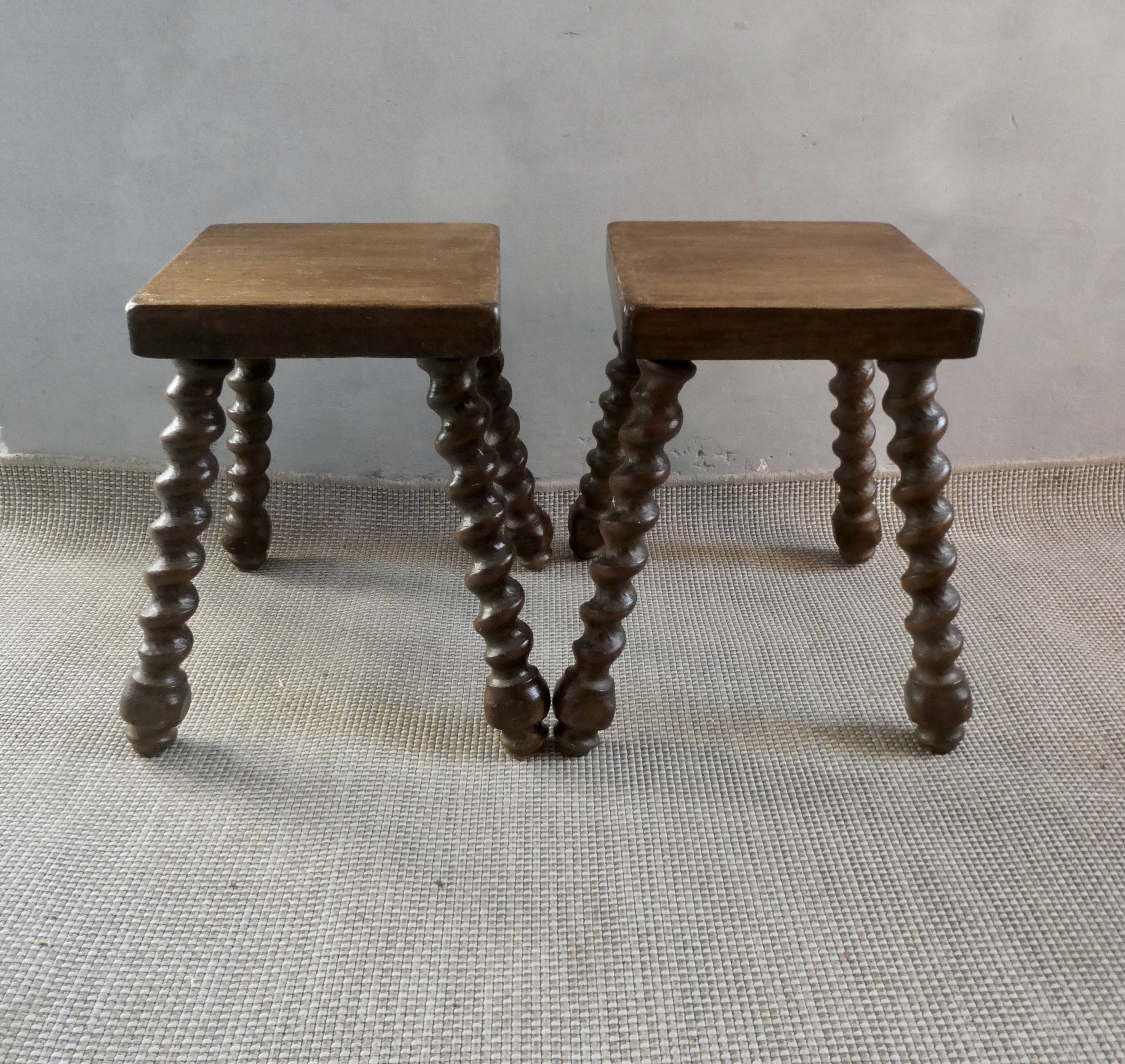Pair of solid wood stools, carved legs