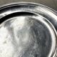 Round silver-plated metal dish monogrammed "MR"