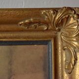 Old large wall frame in gilded carved wood