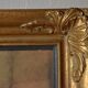 Old large wall frame in gilded carved wood