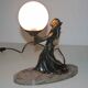 Art deco lamp in regul and marble "woman holding a globe"
