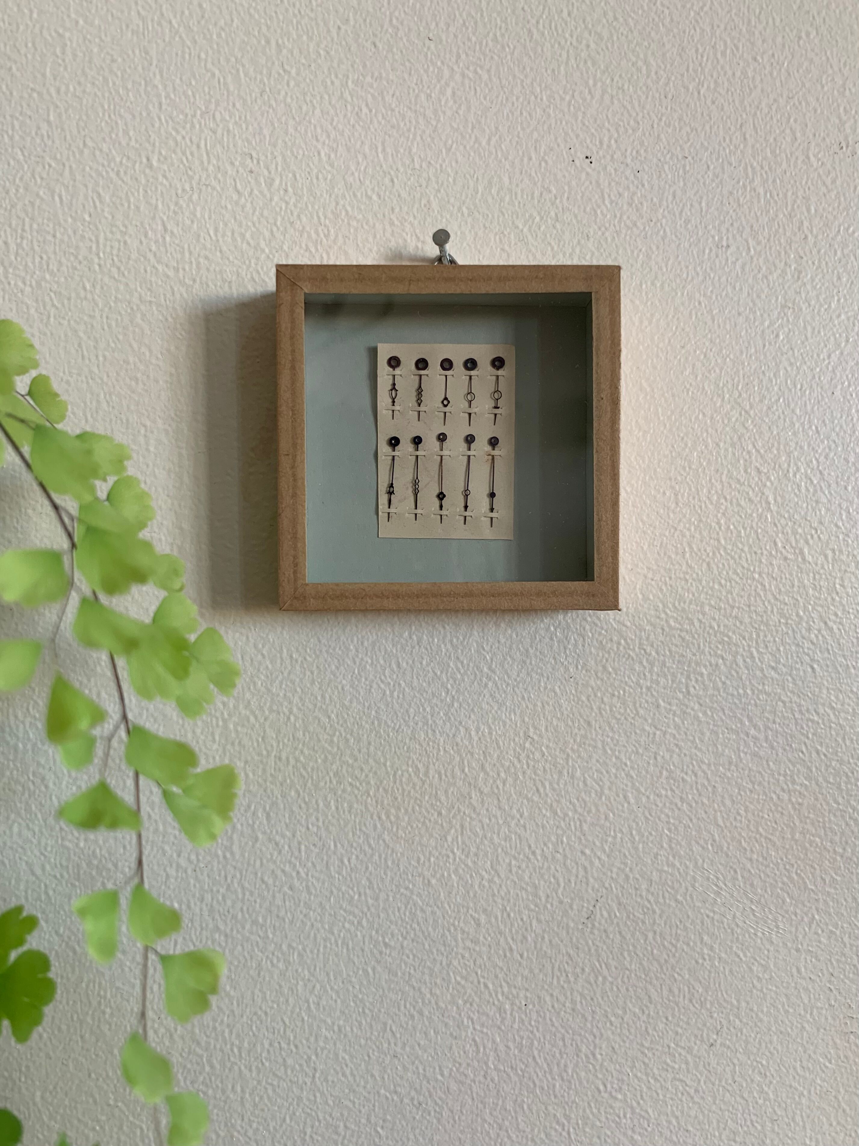 Miniature frame, antique pocket watch hands