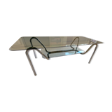 Double top coffee table in smoked glass and tubular structure in chromed steel