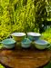 Set of 5 mismatched vintage pastel-coloured cups.