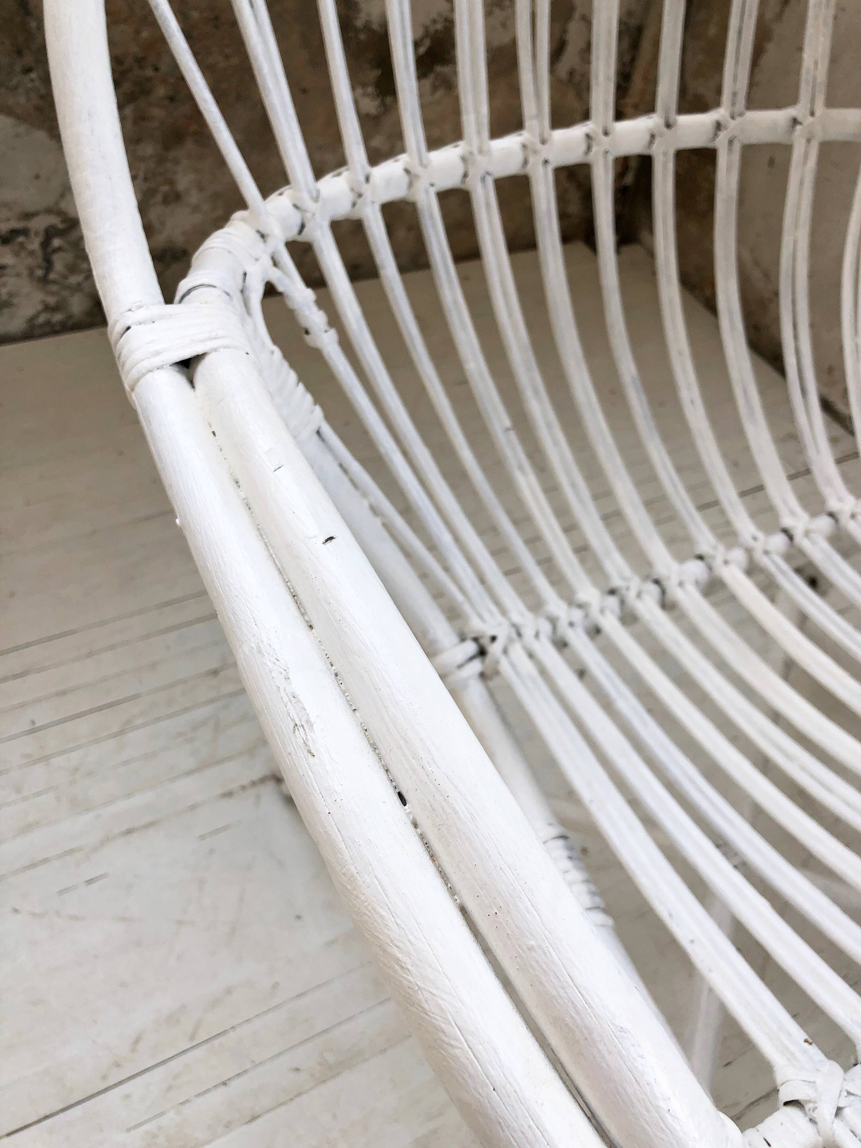 Pair of white rotin armchairs