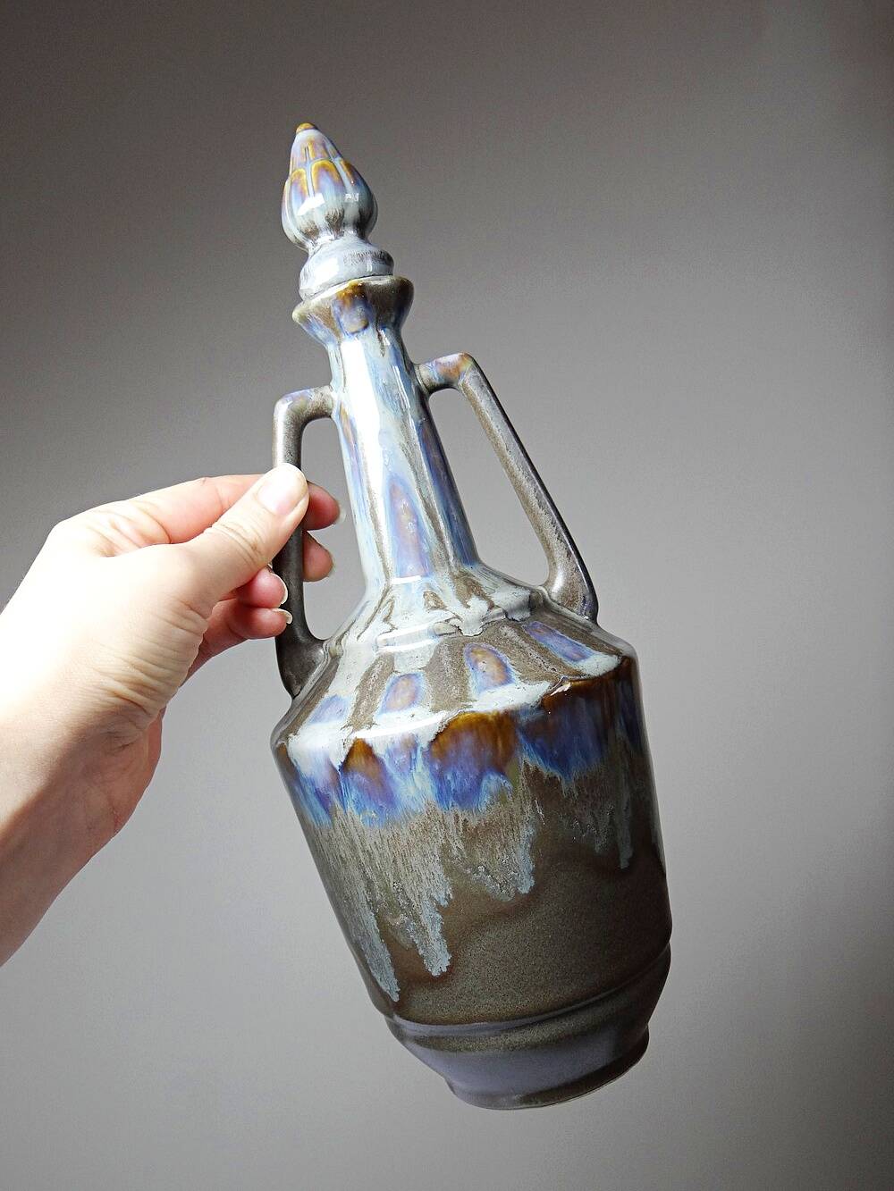 Vintage stoneware bottle with flamed glaze, France 1950-1970.