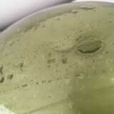 Old demijohn full of bubbles