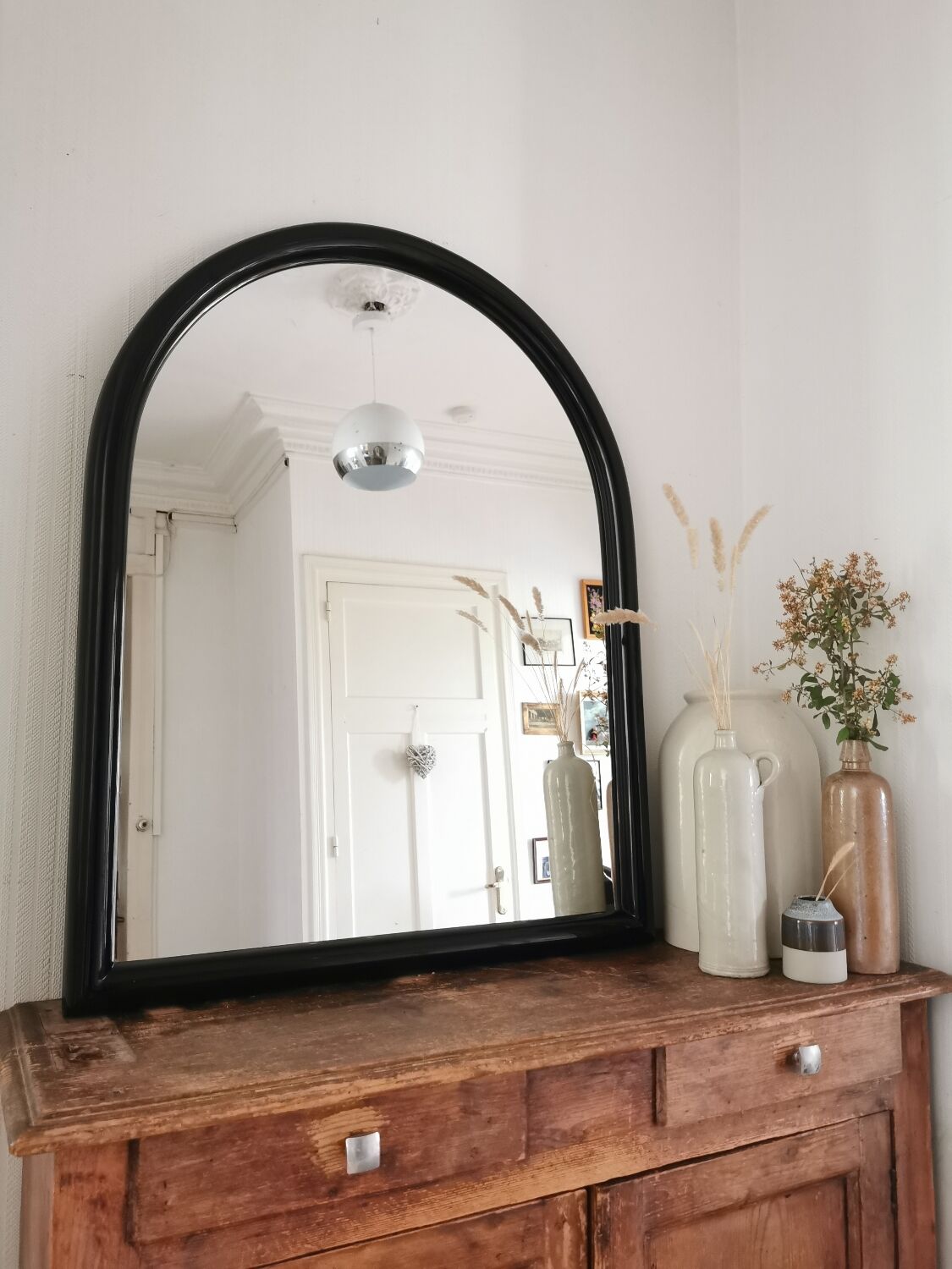 Large black lacquered mirror 1970