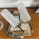 Pair of vintage wall sconces in plexiglass plastic and brass.