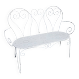 Old garden bench in solid wrought iron