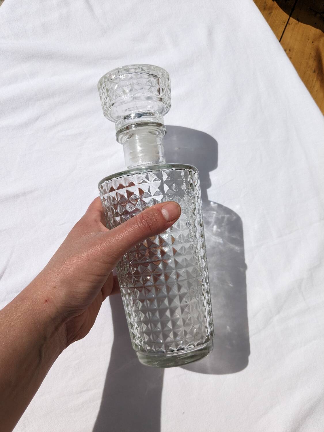 Old relief glass carafe with stopper