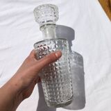Old relief glass carafe with stopper
