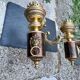 Wall light with 2 branches in baroque brass lion design.