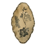 Old earthenware dish on foot