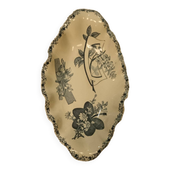 Old earthenware dish on foot