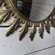 Witch's eye sun mirror in gold metal from the 60s