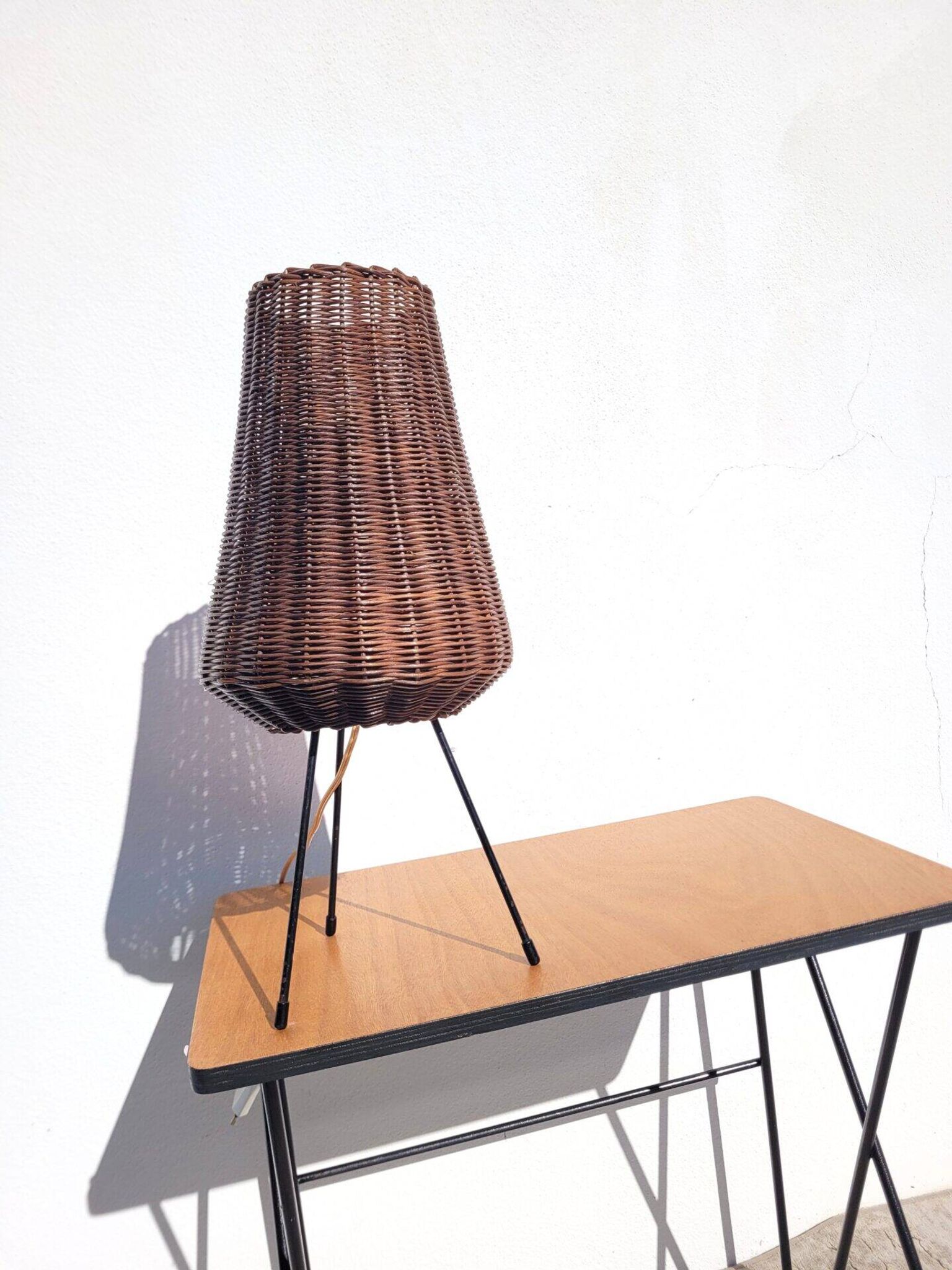 Tripod lamp and rattan from the 1950s.