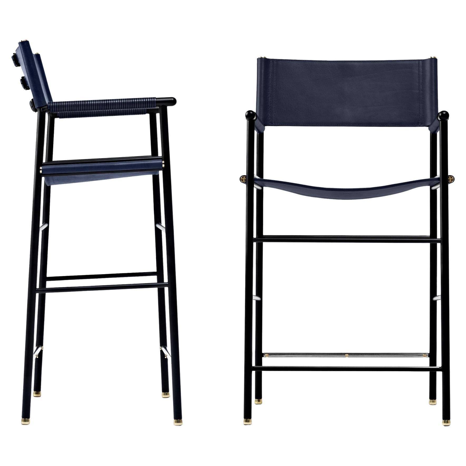 A pair of bar stools with a navy blue leather backrest and black rubber.