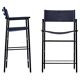A pair of bar stools with a navy blue leather backrest and black rubber.