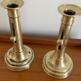 Pair of antique brass push candlesticks