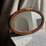 Small oval Art Deco mirror in brown and gold 33x54.