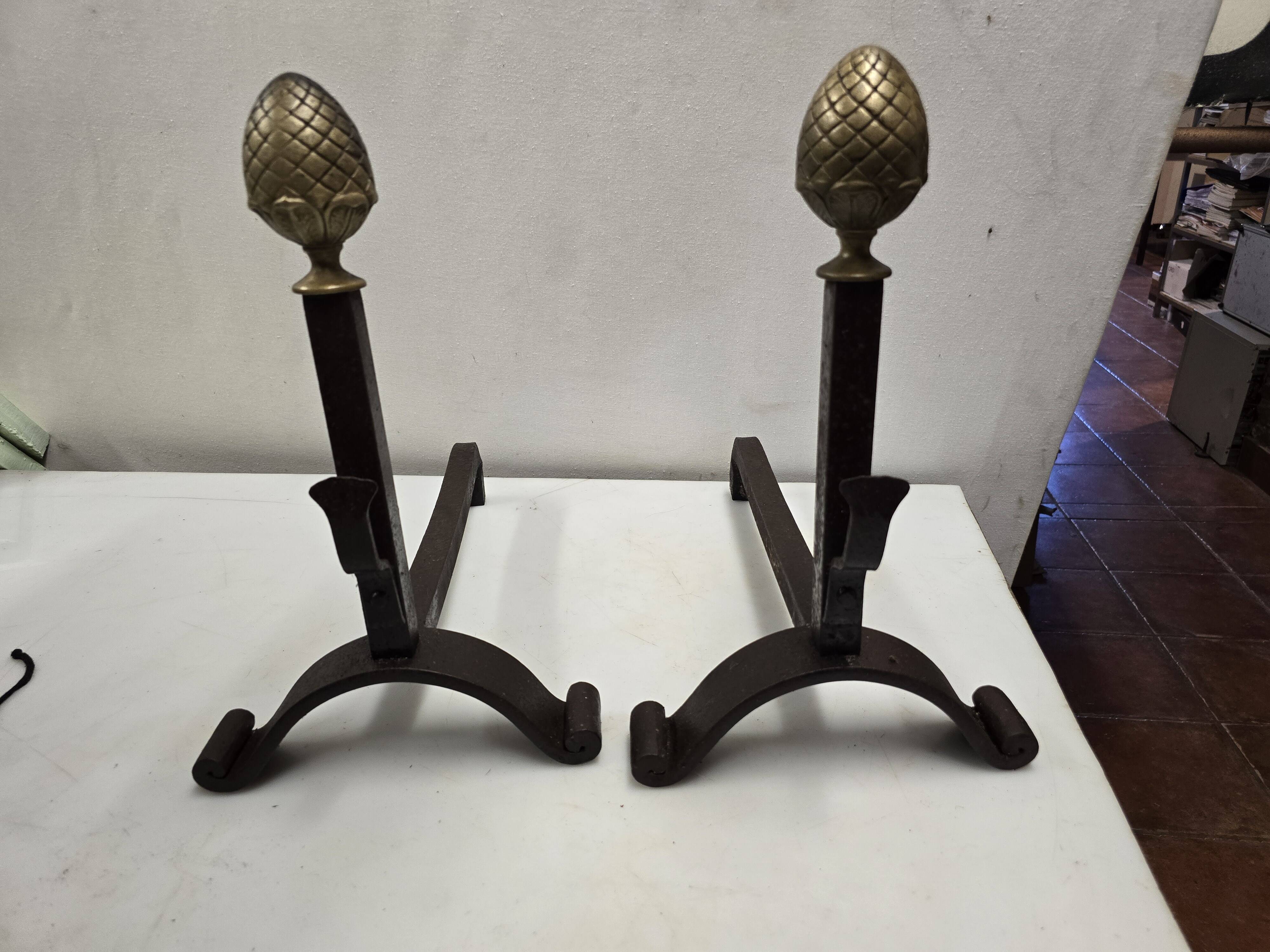 Old pair of wrought iron and bronze andirons