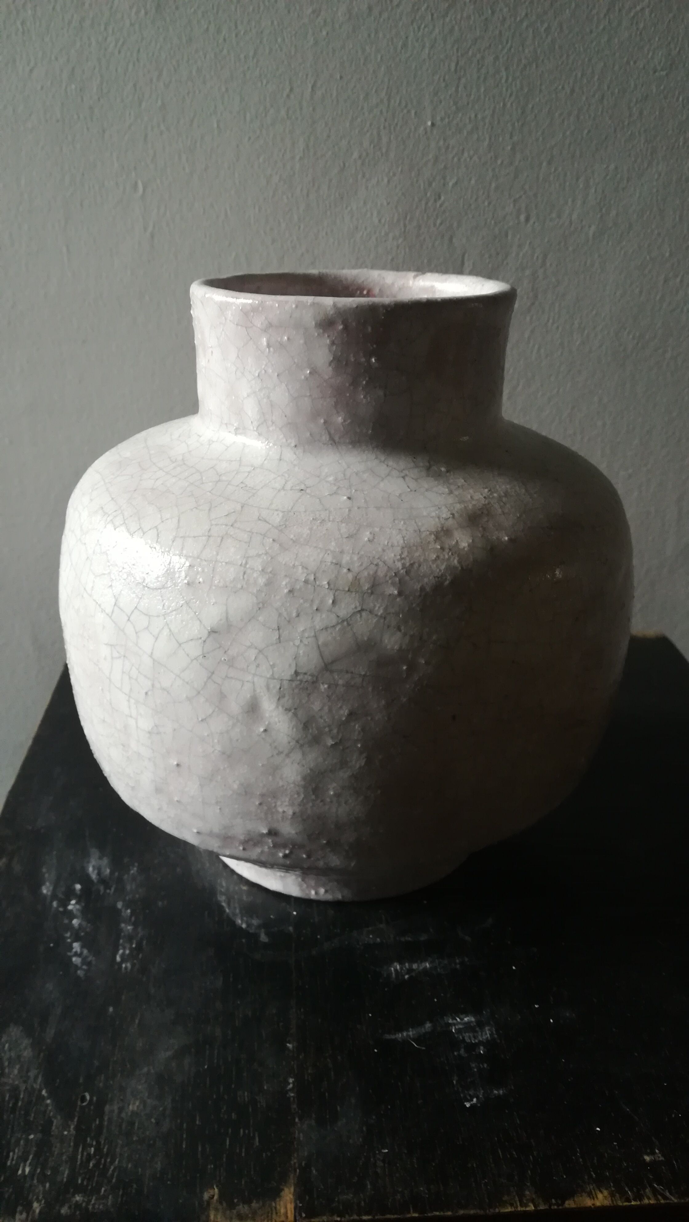Vase covered white crusty and cracked ceramic,