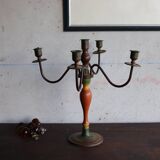 Old candlestick in painted wood and folding metal