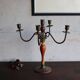 Old candlestick in painted wood and folding metal