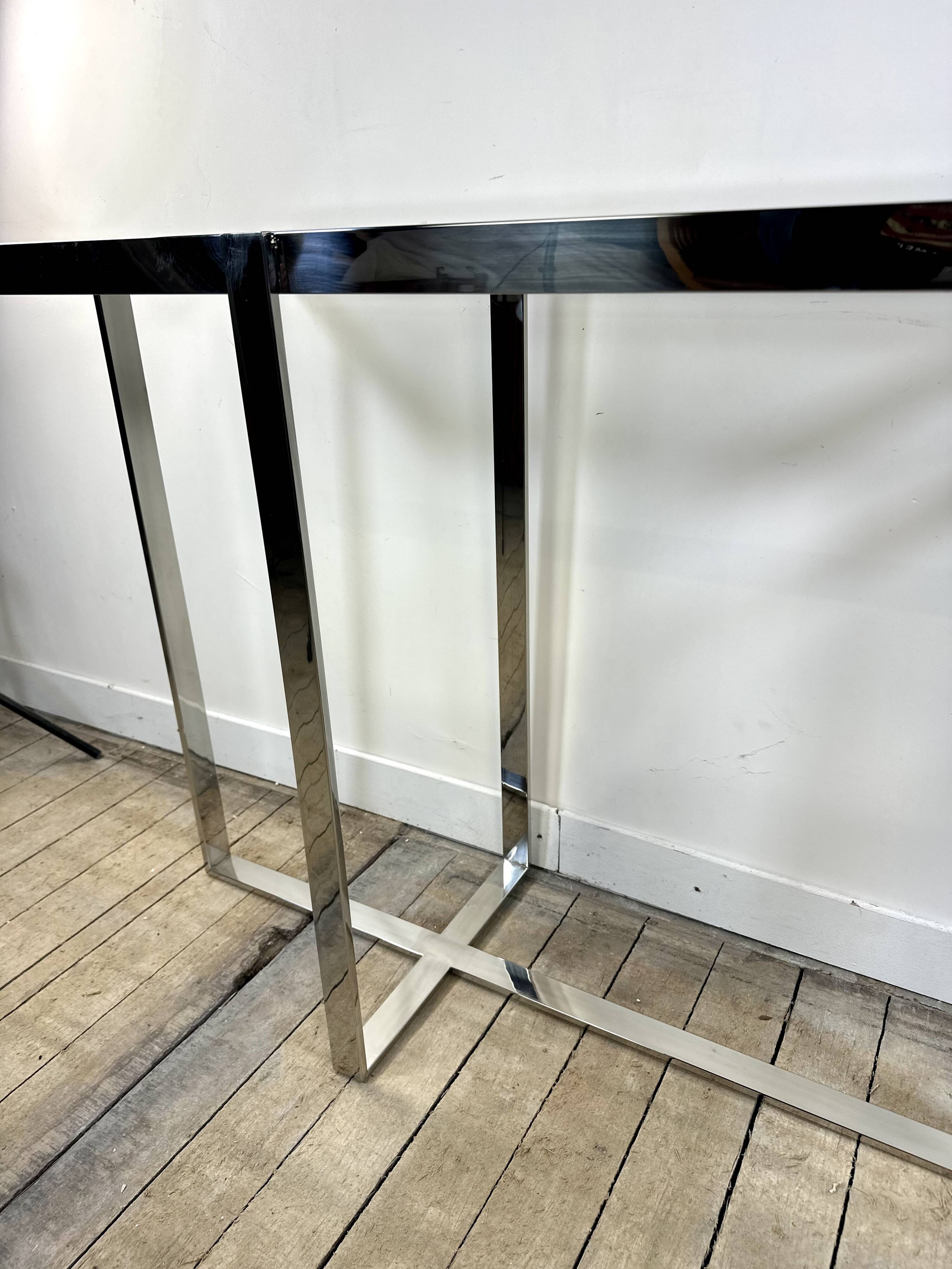 Chrome metal and glass console from the 2000s.
