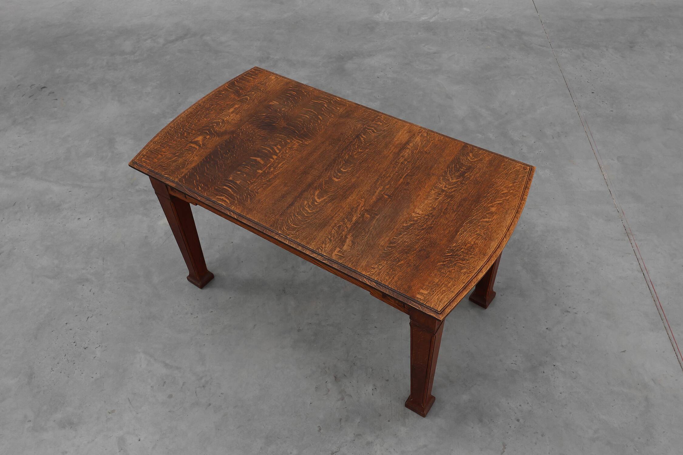 Oak Art Deco dining table with carved frieze, France 1920s