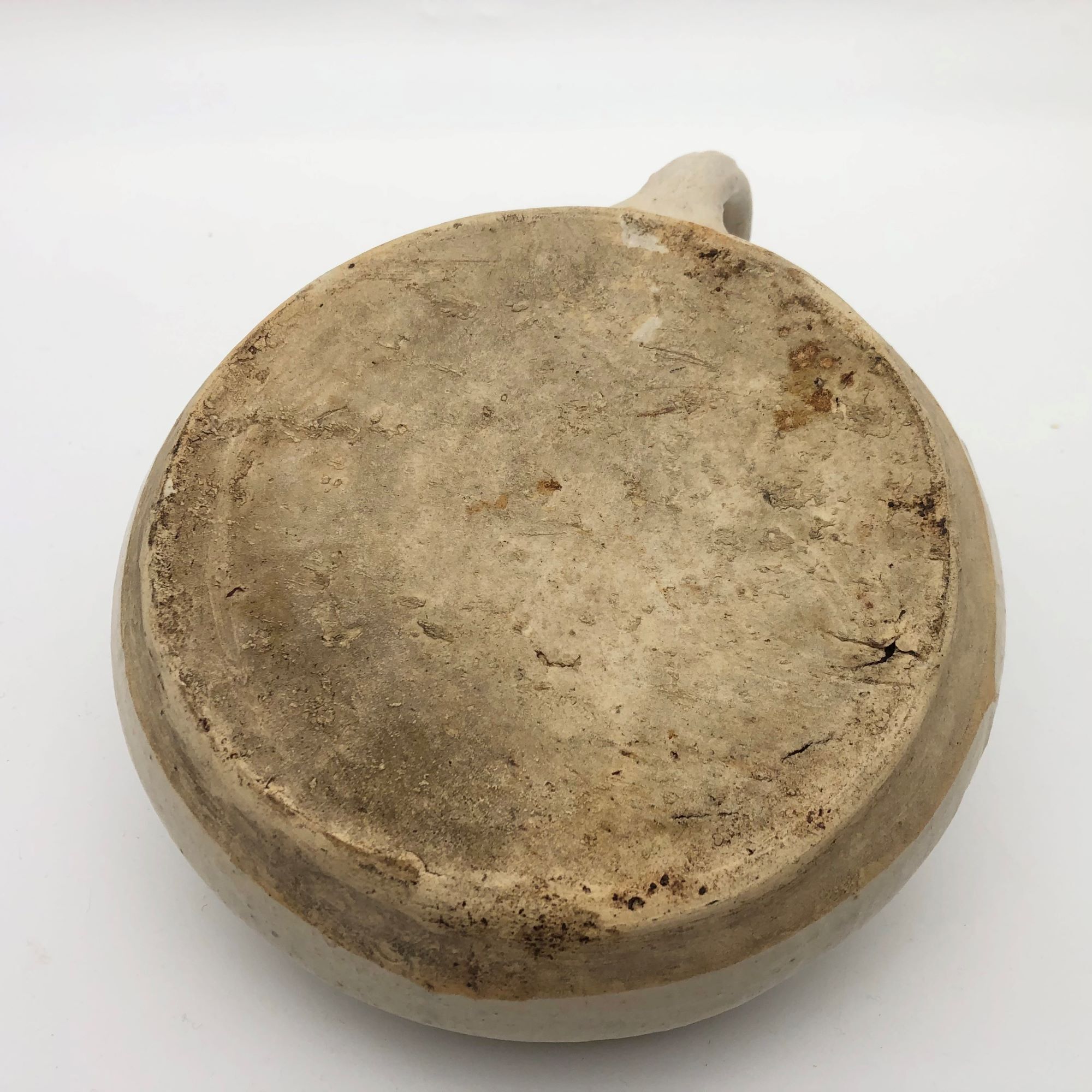Old round sandstone hot water bottle