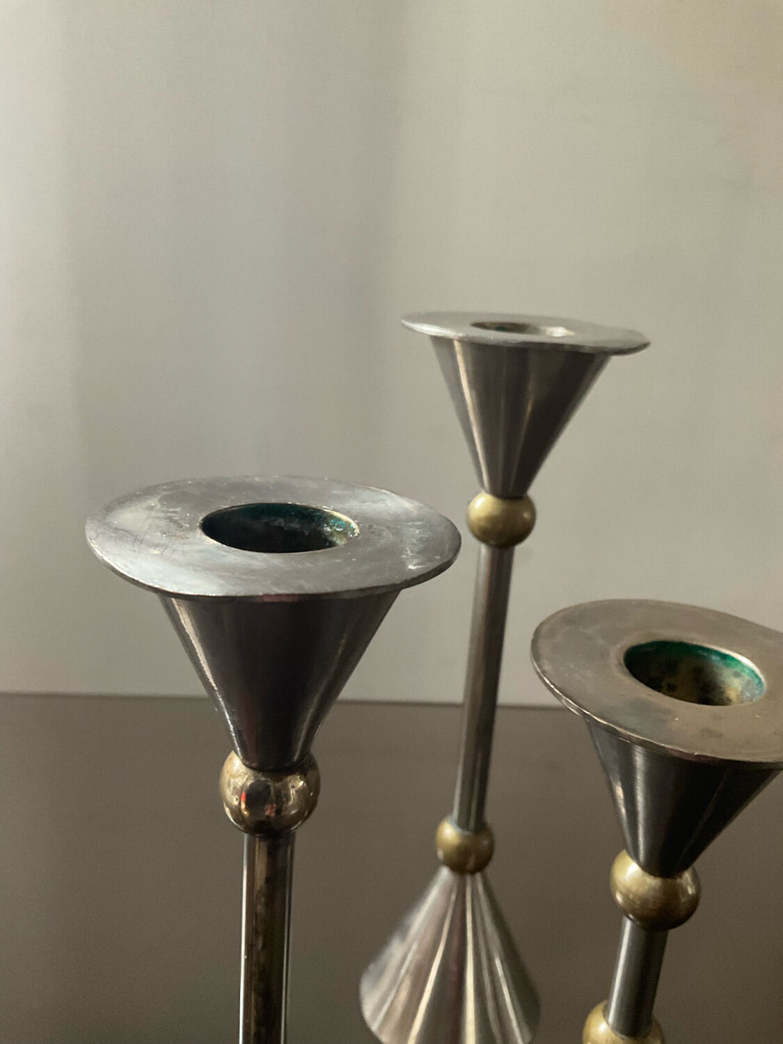 Trio of vintage metal and bronze candle holders