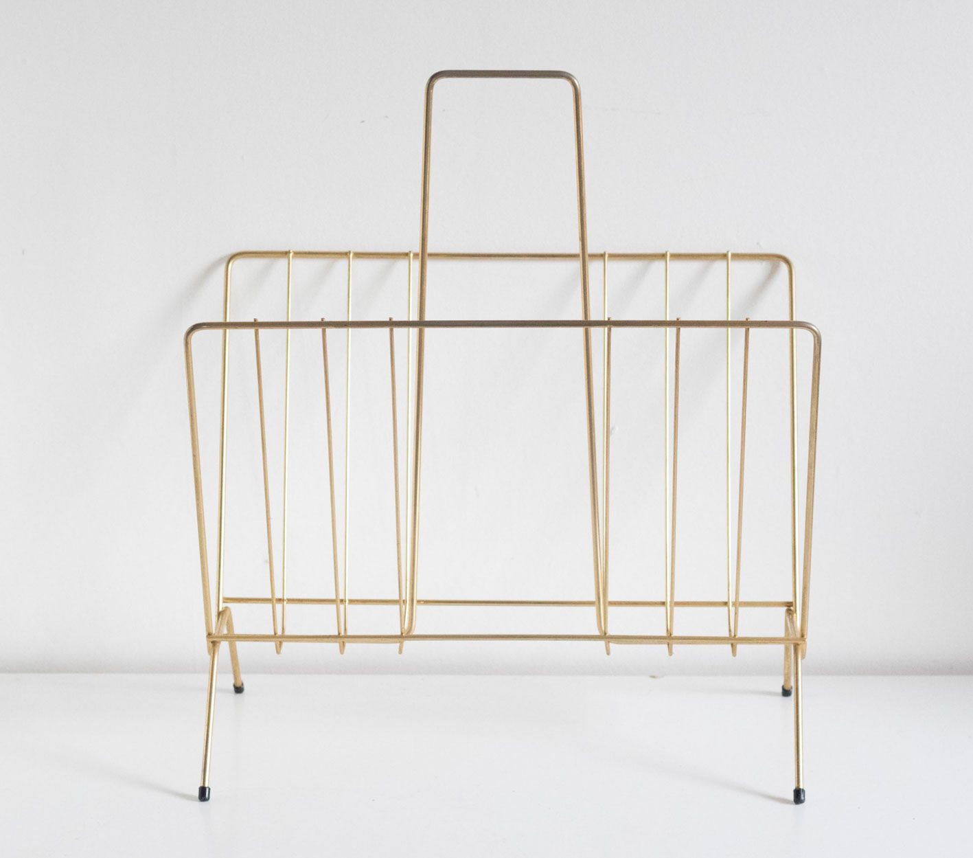 Vintage magazine holder in gold metal