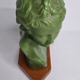 Bust of Eros in patinated plaster in imitation of bronze on wooden base