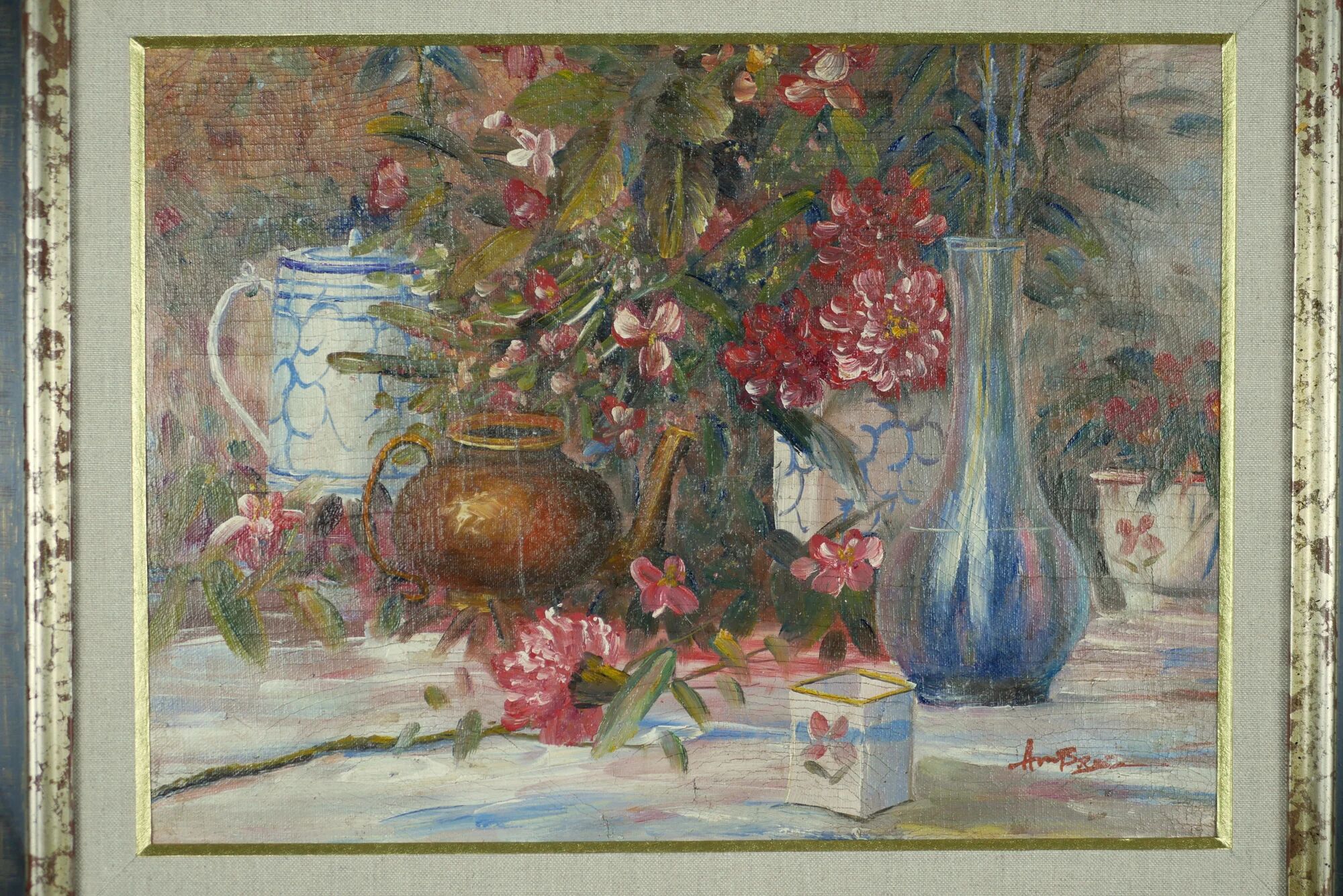 Still life with pink flowers and blue pots.