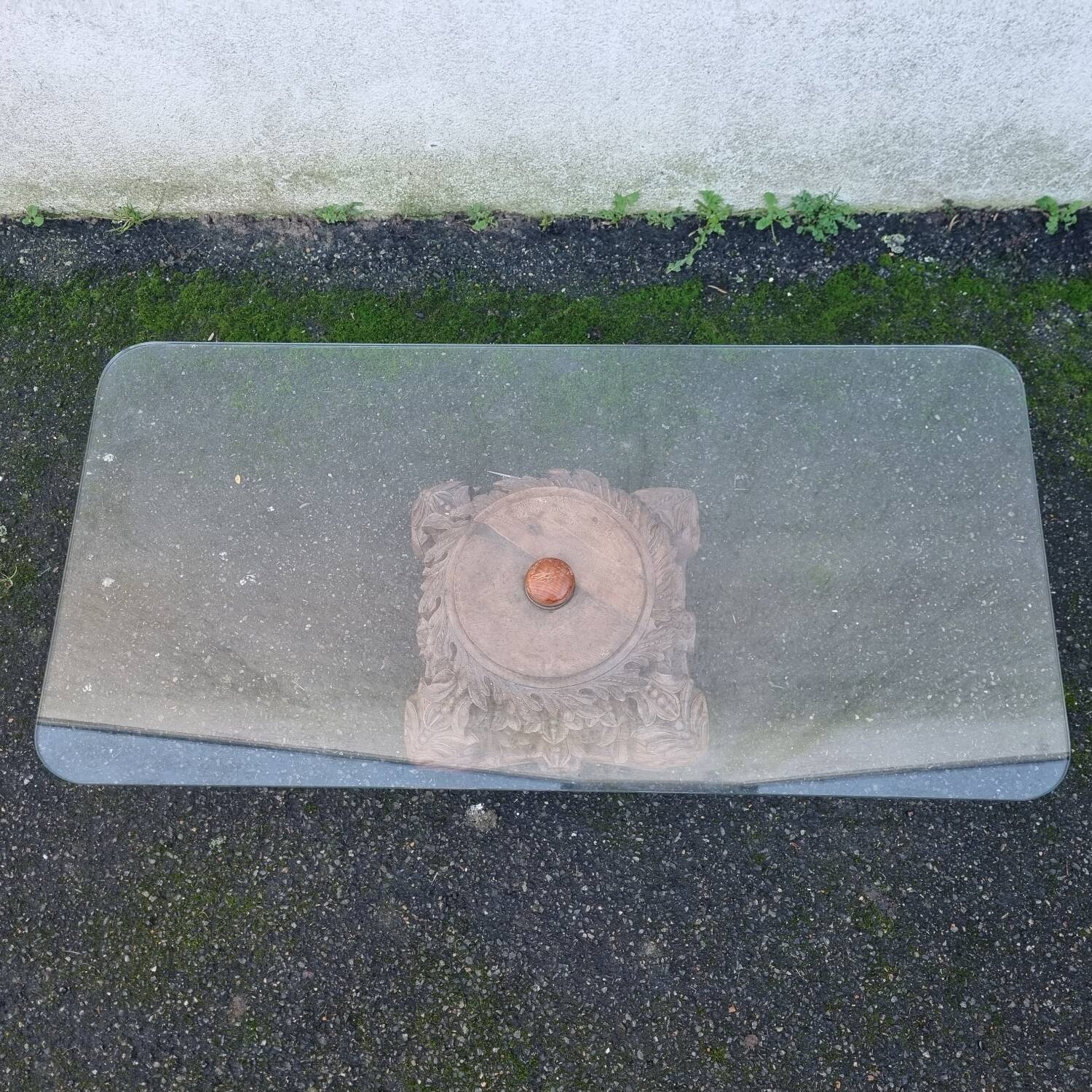 Coffee table with carved wooden base from India, glass top