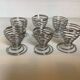 Six metal spiral spring egg cups