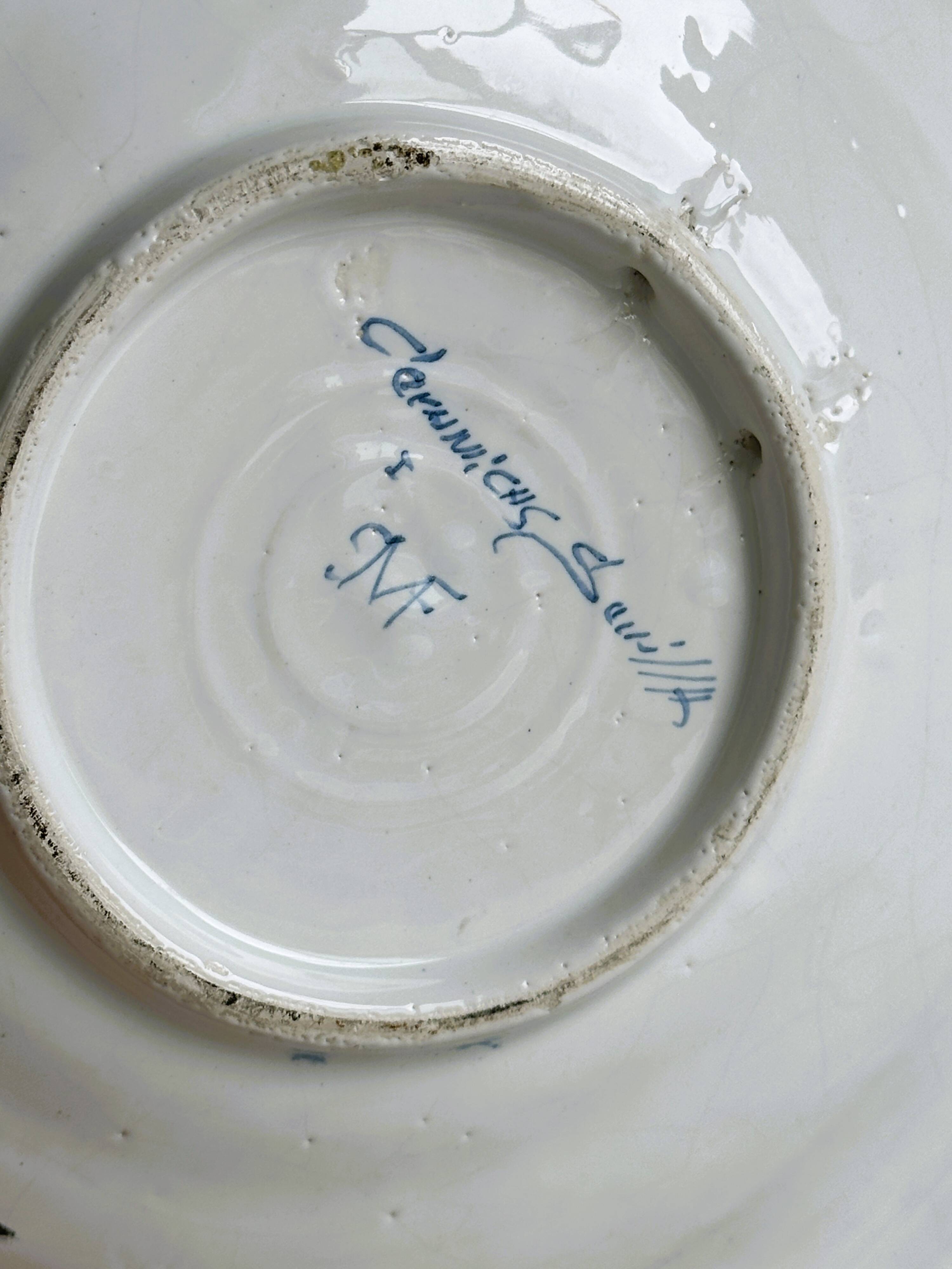 Hand painted decorative dish with floral motifs